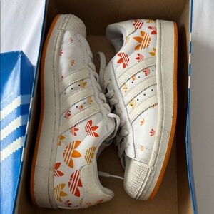 Classic Adidas White Sneakers with orange vintage logo.